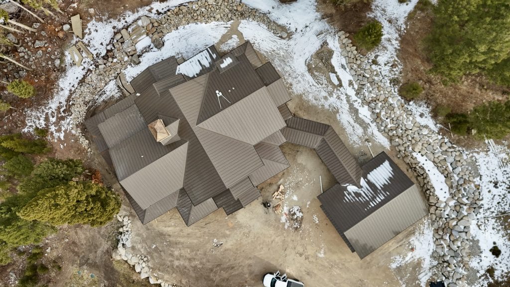Aerial view of a complex metal roofing job